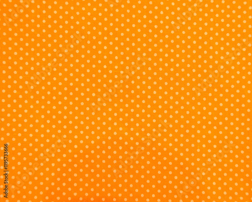 Full frame close-up of orange and yellow polka dot fabric