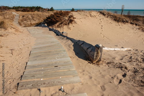 Retaining wall, alongside the cordwalk, prevents sand dune erosion along the  Lake Michigan shoreline on a Wisconsin autumn day, Kohler-Andrae State Park, Sheboygan, Wisconsin photo