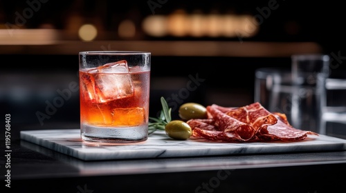 Enjoying a negroni cocktail alongside a selection of artisan charcuterie in a stylish bar setting during the evening hours