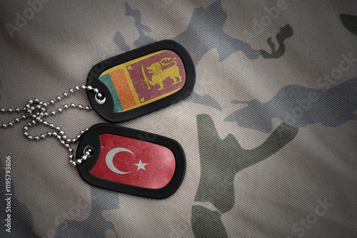 vintage army blank, dog tag with flag of sri lanka and turkey on the khaki texture background. military concept. photo