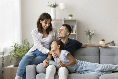 Fényképezés Loving parents spend time with cute daughter, having fun, laughing, feel uncondi