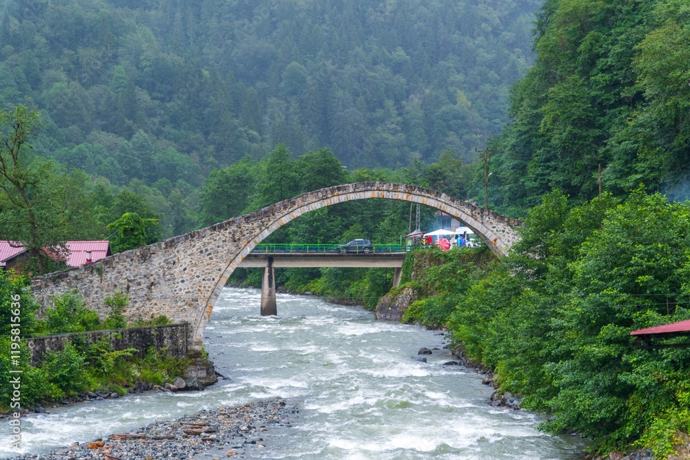 Breathtaking view of the historic Cinciva Bridge and Fırtına Valley in Çamlıhemşin, Rize, Turkey. Breathtaking view of the historic Cinciva Bridge and Fırtına Valley in Çamlıhemşin, Rize, Turkey.