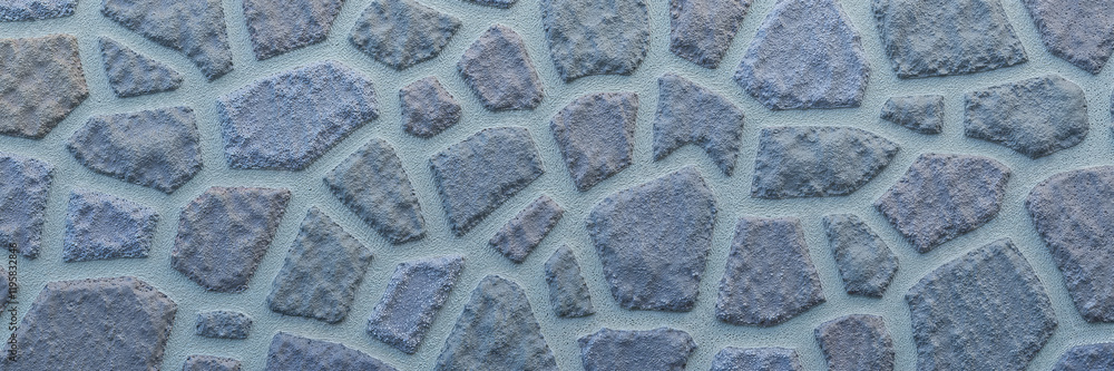 Blue stone wall with irregular shapes and textured surface
Blue stone wall with irregular shapes and textured surface