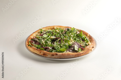 delicious pizza margherita with arugula, bresaola, parmesan and mozzarella on white background - valtellinese photo