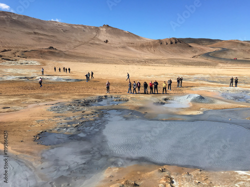 Námaskarð geothermal area with bubbling mud pools and landscapes colored by minerals is an otherworldly scene, in north Iceland.