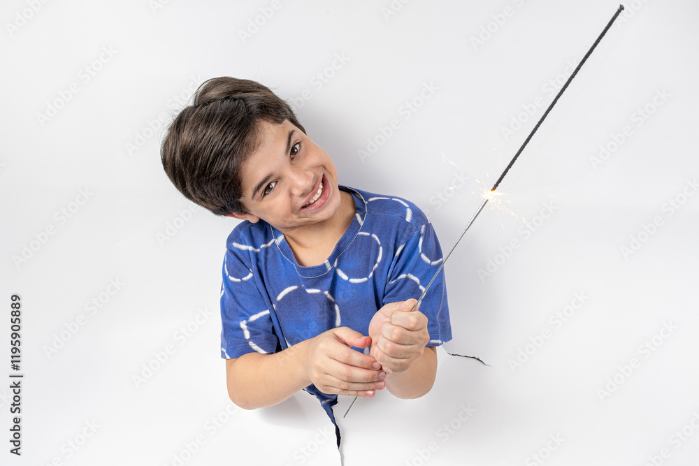 11 year old Brazilian boy with his body passed through a white cardboard and holding a lit sparkle candle_f. 11 year old Brazilian boy with his body passed through a white cardboard and holding a lit sparkle candle_f.