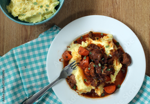 Stew with mashed potatoes and carrots, top view