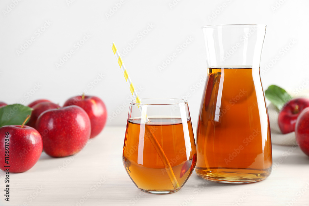 Fresh apple juice and fruits on white wooden table Fresh apple juice and fruits on white wooden table