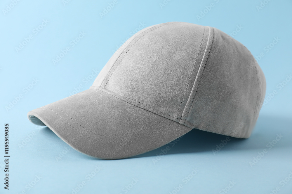 Stylish baseball cap on light blue background, closeup. Mockup for design Stylish baseball cap on light blue background, closeup. Mockup for design