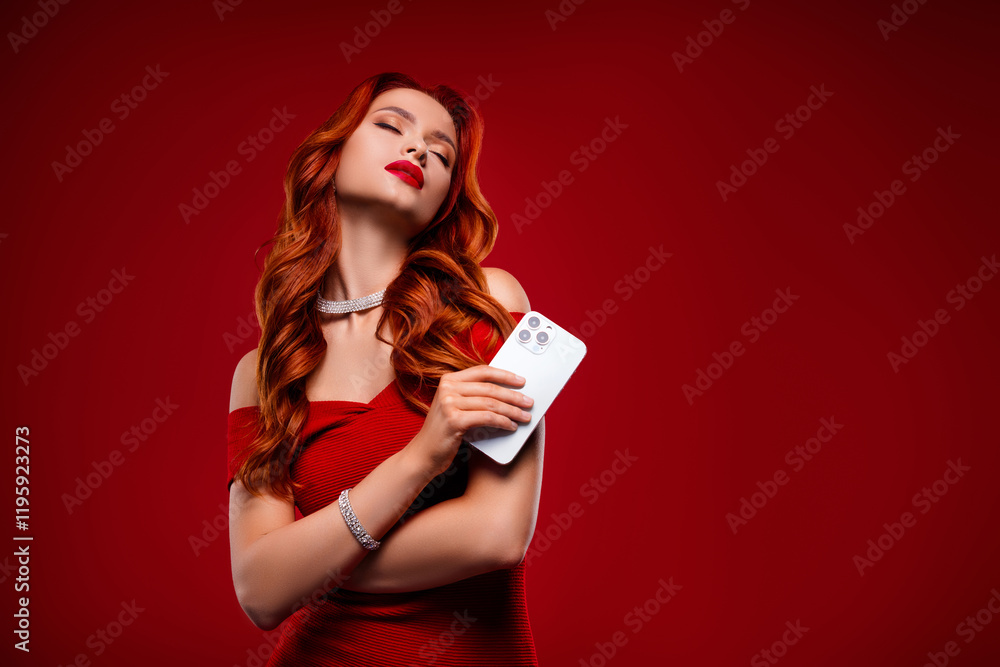 Photo of classy girl in evening gown hold cell smart device close eyes feel tempting on red color background Photo of classy girl in evening gown hold cell smart device close eyes feel tempting on red color background
