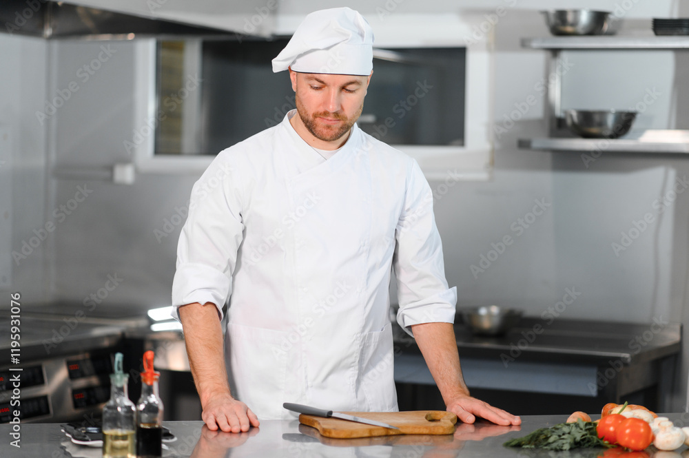 Chef cook preparing vegetables in his kitchen Chef cook preparing vegetables in his kitchen