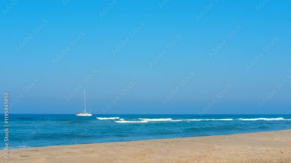 Sailboat slowly moving on horizon on sunny day. The pictures are showing the boat from the beach on a sunny day with clear sky Sailboat slowly moving on horizon on sunny day. The pictures are showing the boat from the beach on a sunny day with clear sky