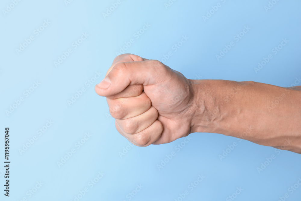 Man with bulging veins on his arm against light blue background, closeup Man with bulging veins on his arm against light blue background, closeup