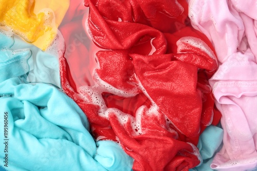 Wallpaper Mural Colorful clothes soaked in water before washing, top view Torontodigital.ca