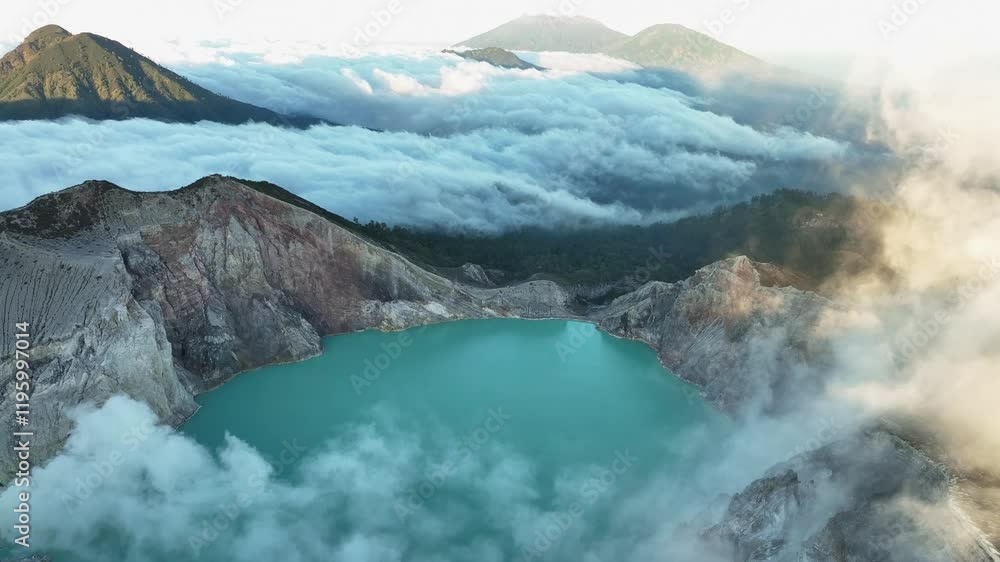 Aerial view Drone shot of fog at Kawah Ijen volcano with turquoise sulfur water lake and sunrise light.Amazing nature landscape view at East Java,Indonesia.Beautiful light Natural landscape background Aerial view Drone shot of fog at Kawah Ijen volcano with turquoise sulfur water lake and sunrise light.Amazing nature landscape view at East Java,Indonesia.Beautiful light Natural landscape background