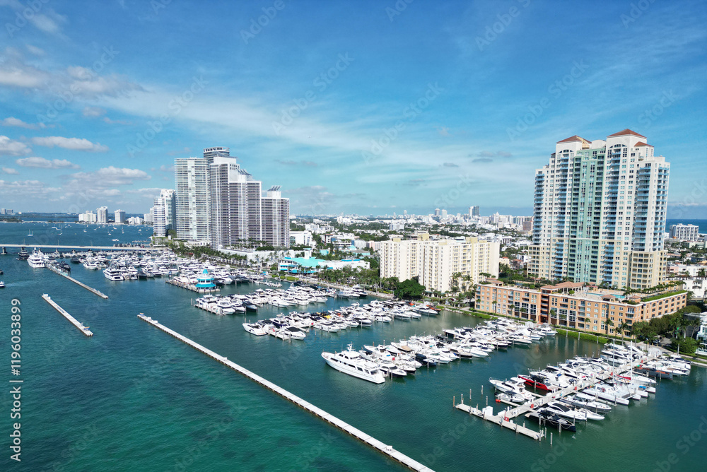 Fototapeta premium Downtown Miami marina with luxury yacht. Summer vacation. Luxury South beach marina. Luxury yacht. Miami south beach view. Yacht club. Marina in Miami, Florida. Biscayne bay. Shimmering waters