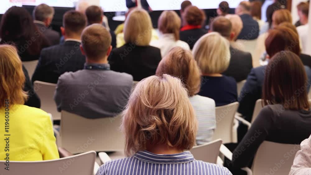 Conference with female audience, the symposium meeting, participants attendees in room hall listen to lecturer, group of women on a congress together listen to speaker on stage at master-class event Conference with female audience, the symposium meeting, participants attendees in room hall listen to lecturer, group of women on a congress together listen to speaker on stage at master-class event