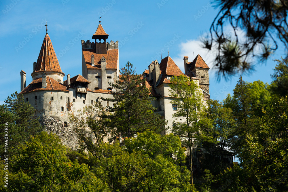 Fototapeta premium View of Bran Castle on cliff top, historically serving as strategic defensive fortress, Romania