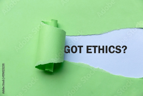 Green Torn Paper Revealing the Word 'Got ethics?'. photo