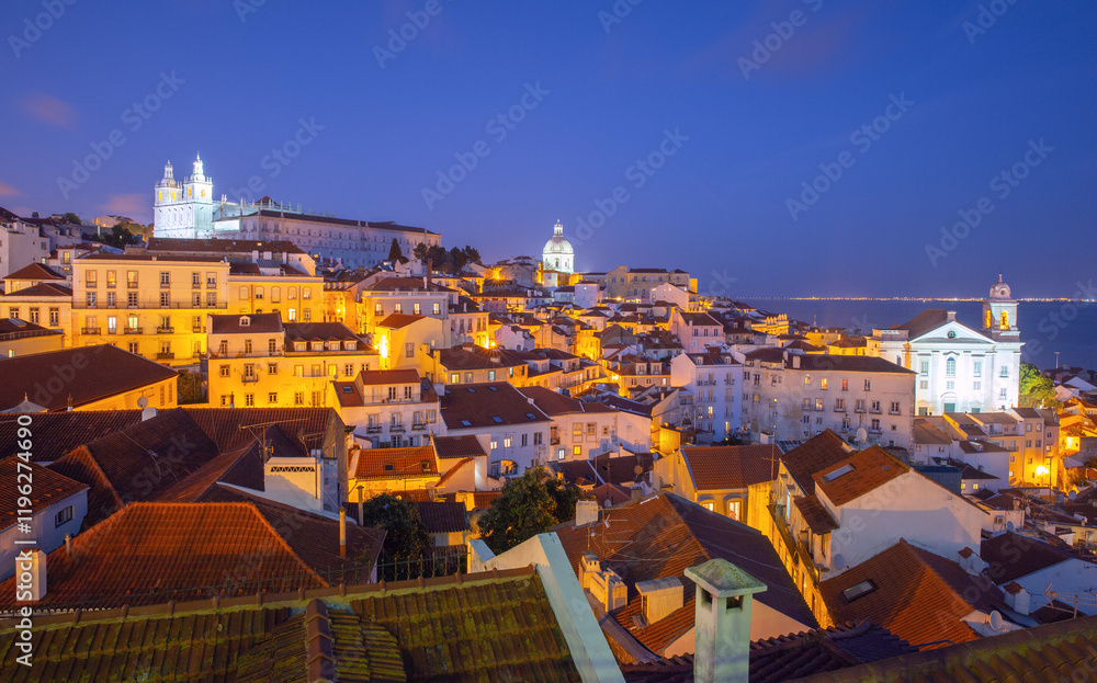 View of the Alfama district with its r, historical architecture at sunset, Lisbon, Portugal
