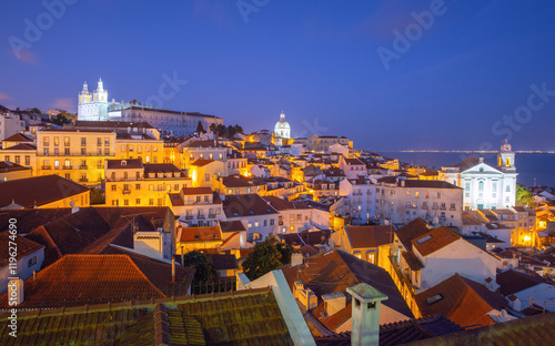 Obraz na płótnie View of the Alfama district with its r, historical architecture at sunset, Lisbon, Portugal w salonie