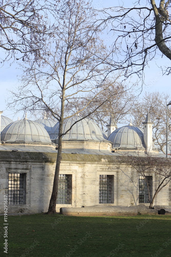 Obraz premium Exploring Historical Architecture: Domes, Stone Walls, and Barred Windows Enhance the Landscape Beautifully.