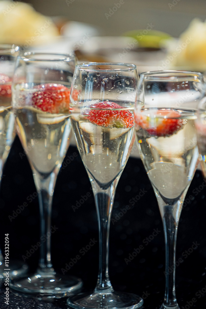 champagne with strawberries on catering table champagne with strawberries on catering table