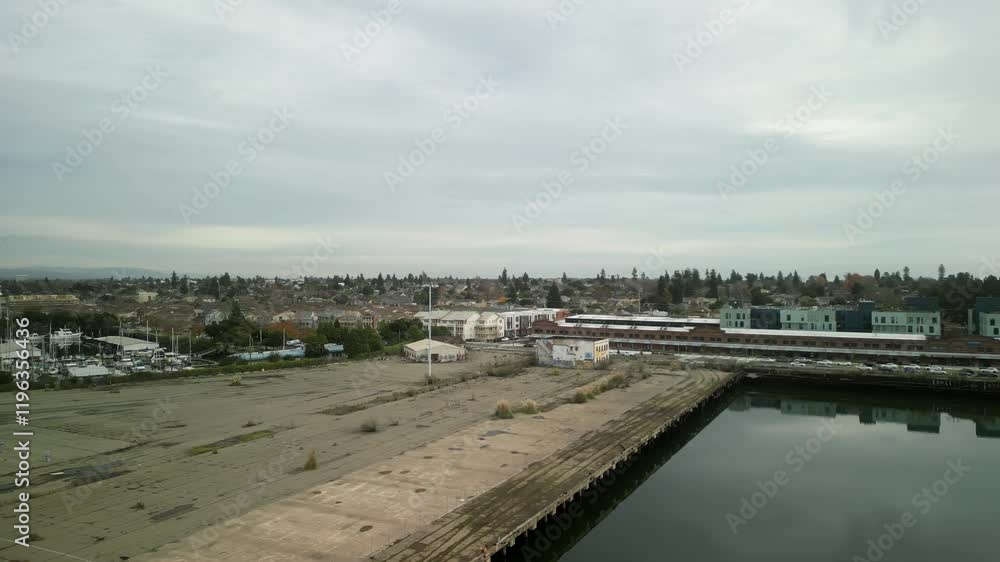 A rotating view of Mariner Square, capturing its pristine waterfront, boat-lined piers, and tranquil coastal scenery. A rotating view of Mariner Square, capturing its pristine waterfront, boat-lined piers, and tranquil coastal scenery.