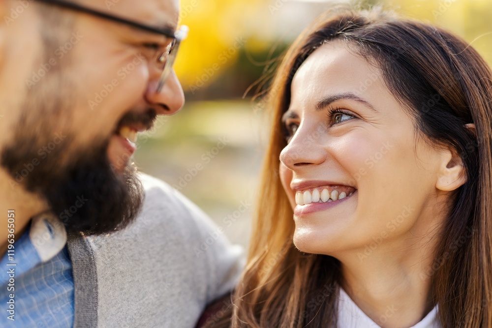 Close up of young happy couple smiling at each other. Celebrating love concept. Close up of young happy couple smiling at each other. Celebrating love concept.