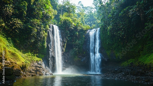 A majestic waterfall cascading into a serene pool, surrounded by lush greenery, capturing the beauty of nature.