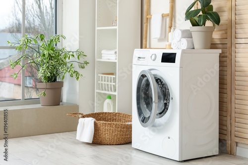 Washing machine with black mold in laundry room photo