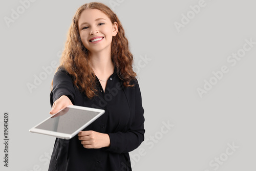 Young businesswoman with ta...