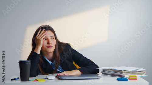 Stressed overworked business woman feel bored modern office. Tired girl hard working use laptop computer. Frustrated disappointed sad female person have burnout. Exhausted businesswoman start up job. photo