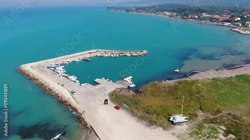 small marina with boats and turquoise water. Astrakeri, corfu island .Greece photo