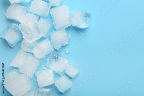 фотографія Many frozen ice cubes on blue background