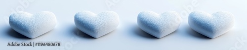 Four light blue fluffy hearts in a row on a white background.
