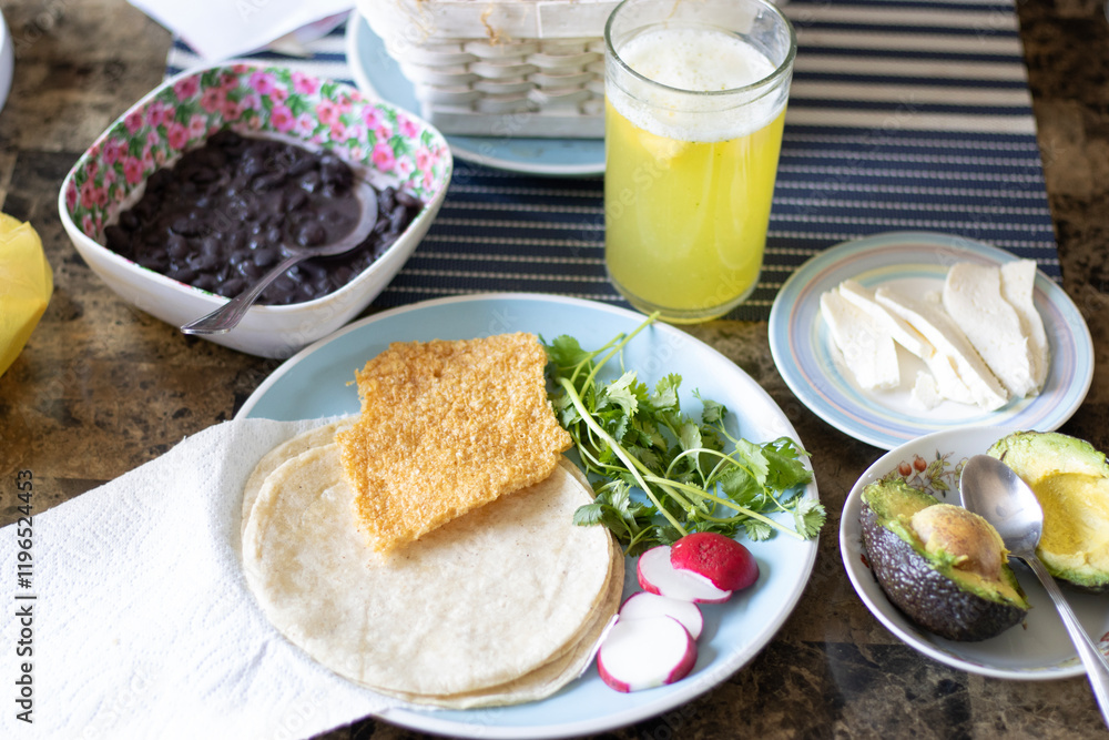 top view of traditional mexican food tacos placeros with chicharron, beans cheese and avocado top view of traditional mexican food tacos placeros with chicharron, beans cheese and avocado