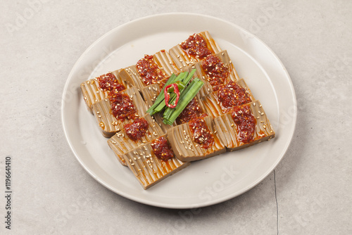 A side dish made with acorn jelly mixed with various vegetables and seasonings. photo