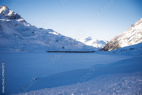 Switzerland Ospizio Bernina Lago Bianco frozen in winter with snow, Bernina train route.