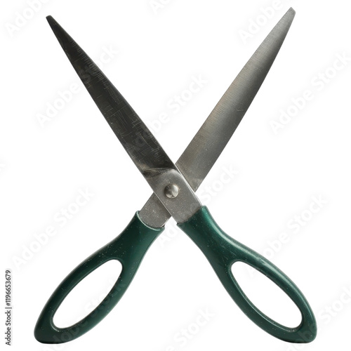 Scissors with green handles against a black background photo