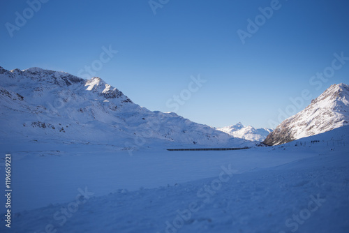Switzerland Ospizio Bernina Lago Bianco frozen in winter with snow, Bernina train route.
