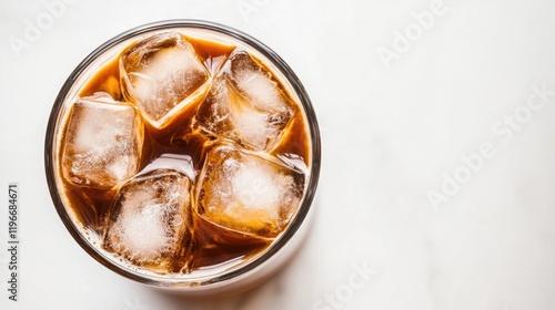 Chilled beverage with ice cubes reflecting light, creating refre photo