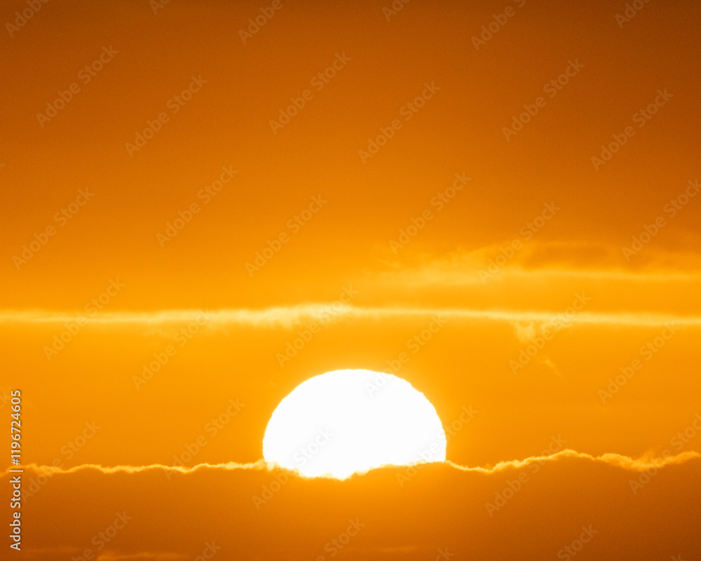 Fototapeta premium Vivid sunset with golden hues illuminating the skies of South Iceland