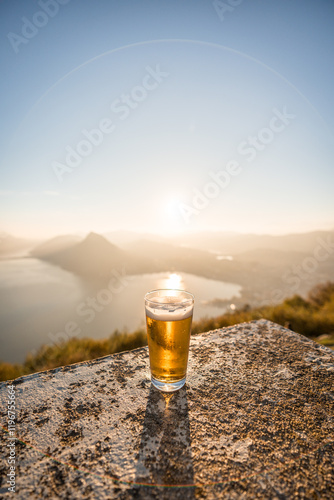 Feierabendbier, nach einer gemütlichen Wanderung hoch zum Monte Bre, Schweiz photo