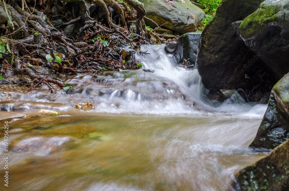 Waterfall in the forest long exposure Waterfall in the forest long exposure