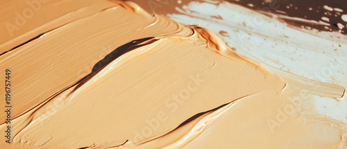 Close-up view of creamy foundation texture showcasing fine pigments and smooth application photo