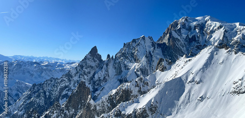 Mont Blanc massif towering over snow covered Alps in Courmayeur, Italy photo