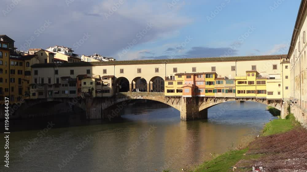 the Ponte Vecchio (Old Bridge) over the Arno River under clear sky in the morning in Florence, Italy the Ponte Vecchio (Old Bridge) over the Arno River under clear sky in the morning in Florence, Italy