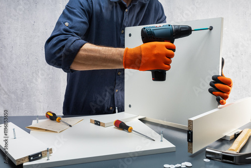 Wallpaper Mural Assembling new furniture. Man, repairman assembling furniture. Selective focus. Torontodigital.ca