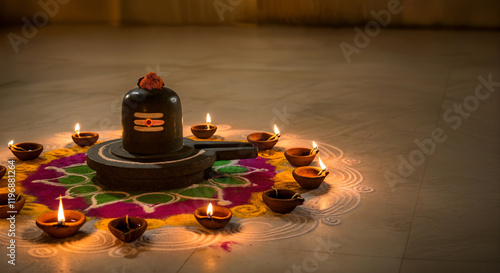 Clay diya oil lamps illuminating a shivling, a representation of the hindu deity shiva, during the diwali festive season photo